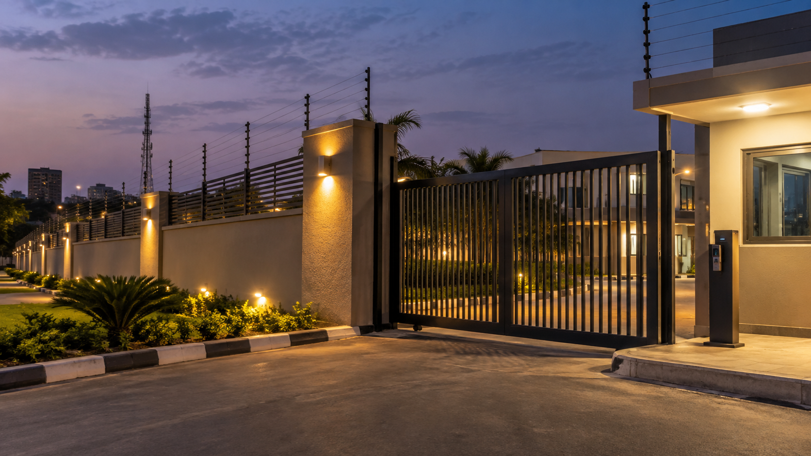 Perimeter fence and secure gate illuminated at night