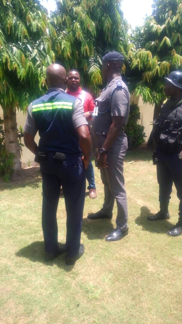 Security team in discussion outdoors